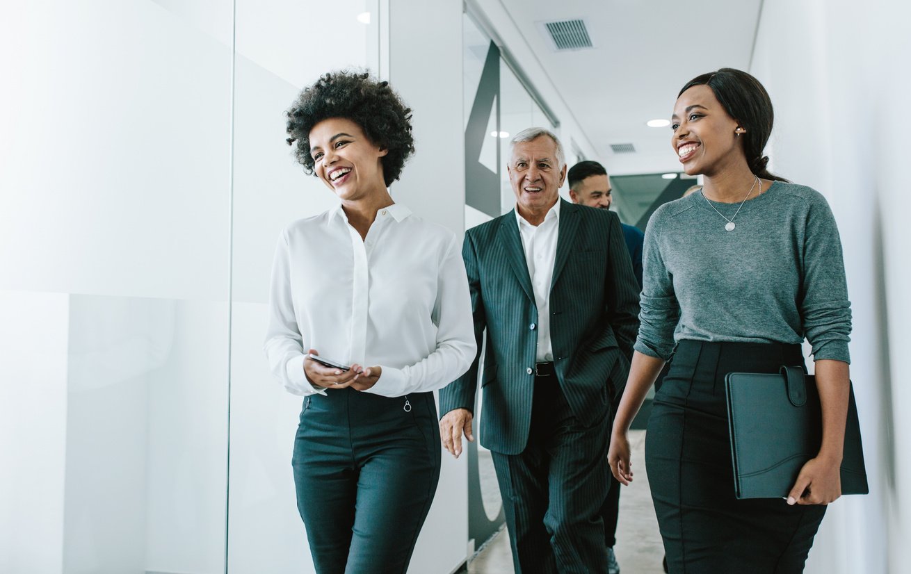 Team of Corporate Professionals in Office Corridor